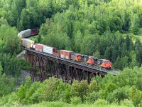 Running about 4 hours late, CN 306 crosses over the trestle at St Eleuthere, PQ on a nice Summer afternoon.
