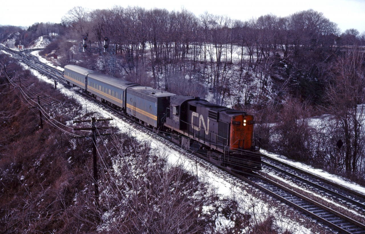 Leased CN RS18 3102 leads an eastbound VIA train through Bayview in early 1982.
