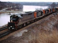 Prior to the start of GO Transit service in May 1967, GO's GP40TC units were tested in CN freight service in southern Ontario. Here we see "CN" 601 (later GO 601, 9801, and 501) leading GP9 4597, two 3600 series RS18s, and SW1200RS 1317 through Bayview with a train from Fort Erie or Niagara Falls in late 1966.