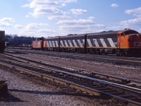Train 725 prepares to depart Hamilton Yard behind an A-B-A of F7 units (9169, 9196, 9172).