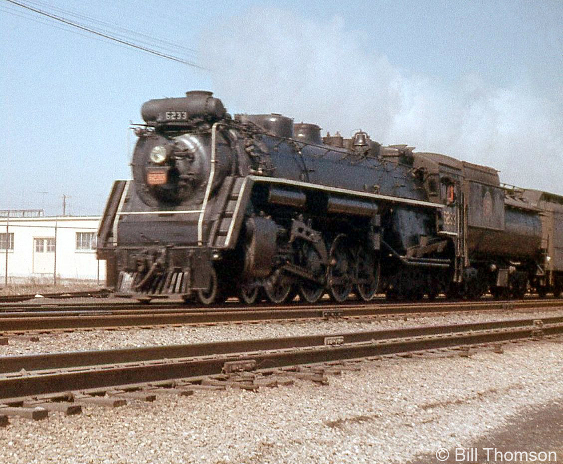 CN 4-8-4 Northern 6233 is shown westbound at Port Credit in 1957. Built in 1943 by MLW as part of the U2g class (6200-6234), 6233 was scrapped in April of 1960.
