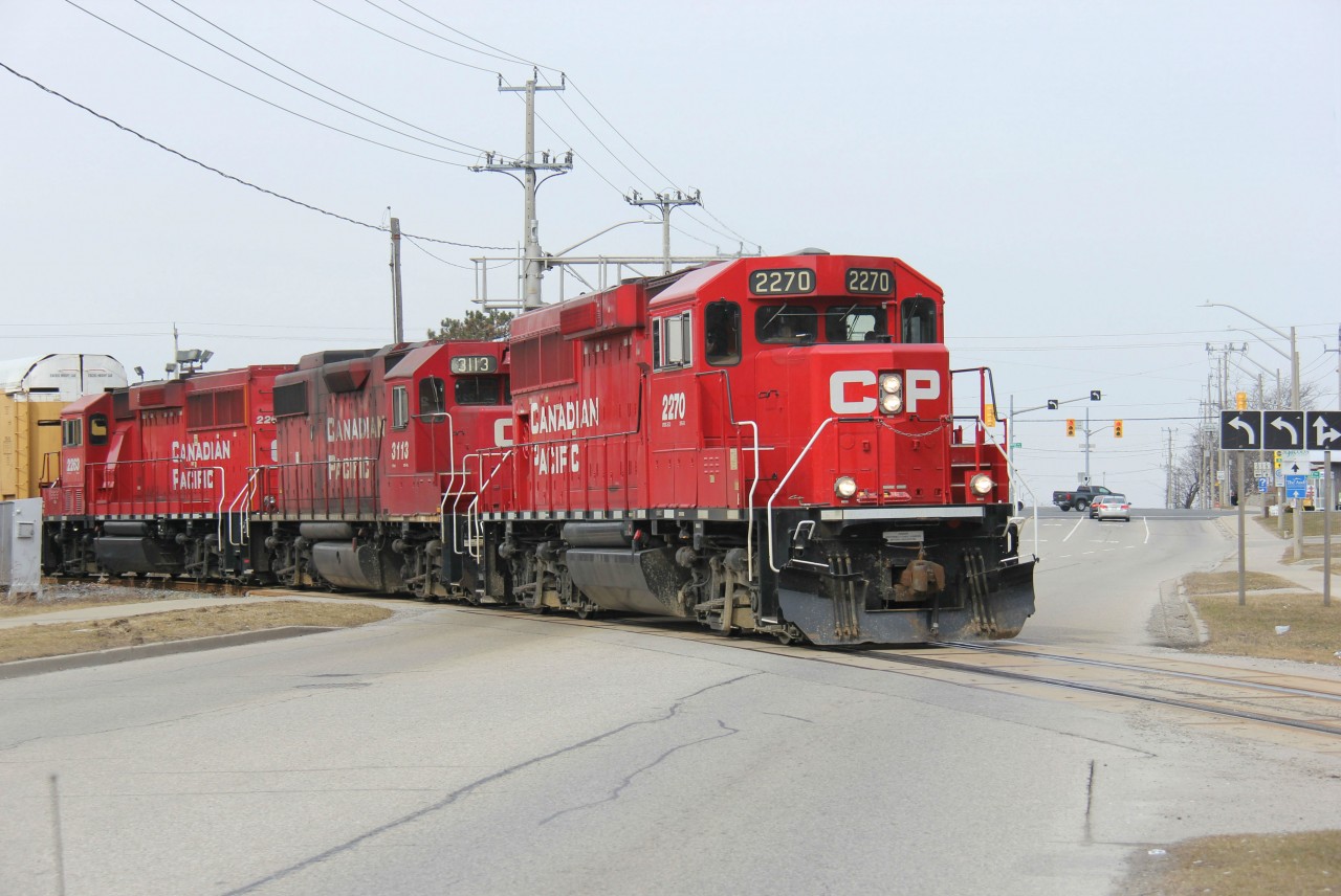 CP 2270 South, or CP T72 (the Wolverton Turn), which I think was the identification of this train, heads south towards Cambridge. It is pictured where the line takes a more north-south trajectory from an east-west one along Courtland Ave./Fairway Rd., originating from the CP/GEXR interchange. It is crossing Old King St. south of Fairway Rd. in an area of southeast Kitchener known as Centreville. Good morning to do some spur of the moment local railfanning!