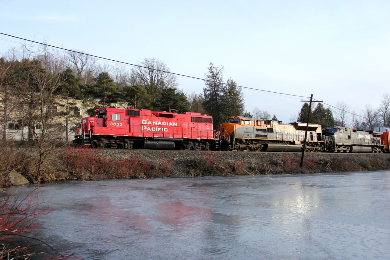 CP 244 hustles eastbound at Campbellville with a pretty short train. Despite hazy sun conditions and less than adequate lighting on the train, I had to catch this because of the power. All elephant-style, CP 3033-NS 1071-NS 9917, lead 244. Not many options for eastbounds at this time of day (around 18:20). This is my first NS heritage unit catch, and it happens to be one of my favourites (next to NS 8105 and the Illinois Terminal one). Too bad it was grimy and not leading. However, at least they chose a half-decent CP leader :)