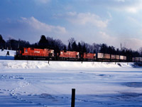M630s 4551, 4554 and M636 4735 lead a late afternoon eastbound through Campbellville in early 1980.