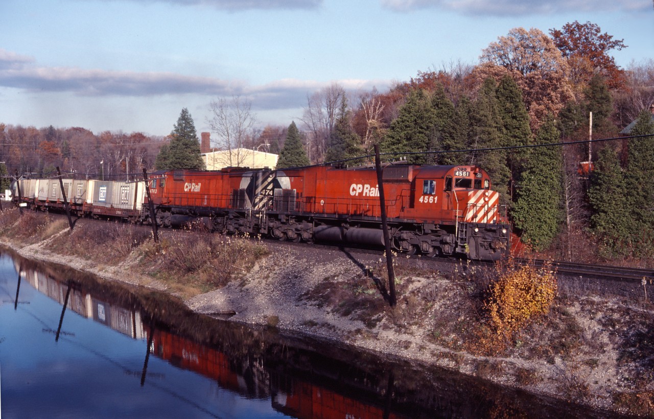 Two "big C's" thunder through Campbellville as they approach Guelph Jct and the summit of the Niagara Escarpment in the fall of 1983.