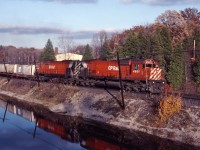 Two "big C's" thunder through Campbellville as they approach Guelph Jct and the summit of the Niagara Escarpment in the fall of 1983.