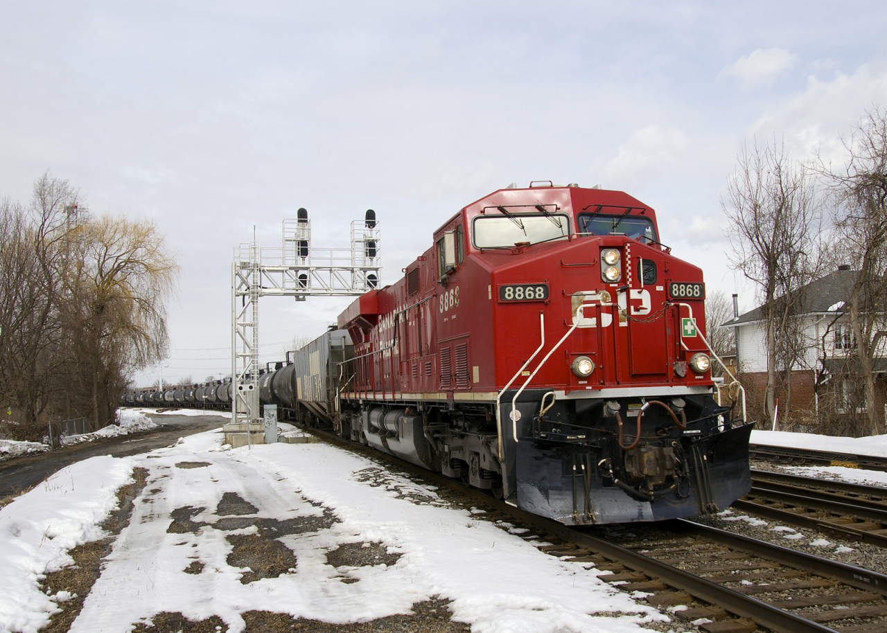 CP 8868 must have been repainted or washed recently, as it really pops. Here it leads ethanol train CP 650 through Lasalle, with CP 8528 assiting at the rear.