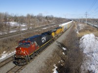 CN 377 always runs with a consist of mixed freight, but today it consisted of 110 autoracks. Power is CN 2693 and ex-SP AC4400CW UP 6284 as it rounds a curve through Beaconsfield.