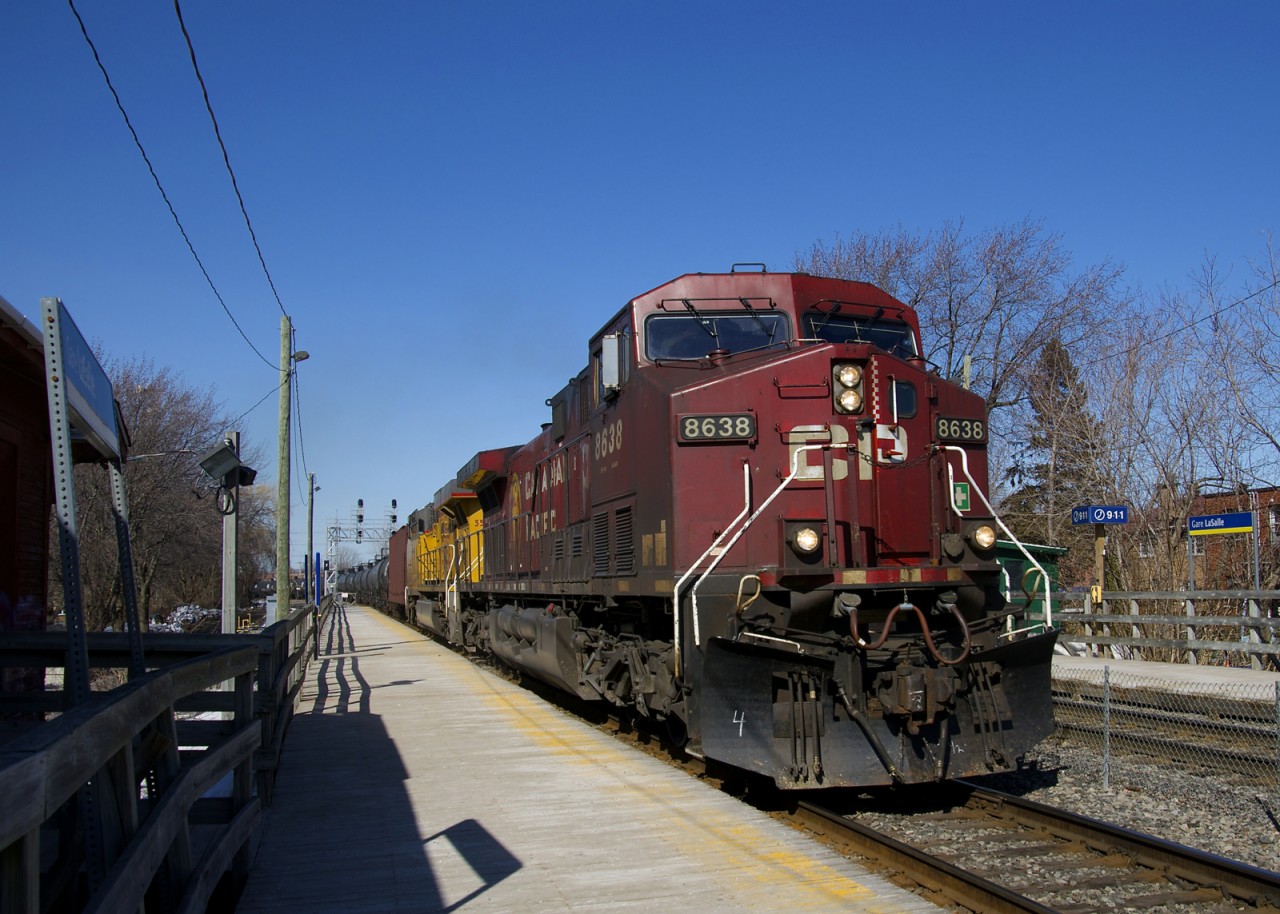Loaded ethanol train CP 650 is speeding past the Lasalle Station with CP 8638 & UP 5506 for power a bit before the afternoon commuter rush begins.