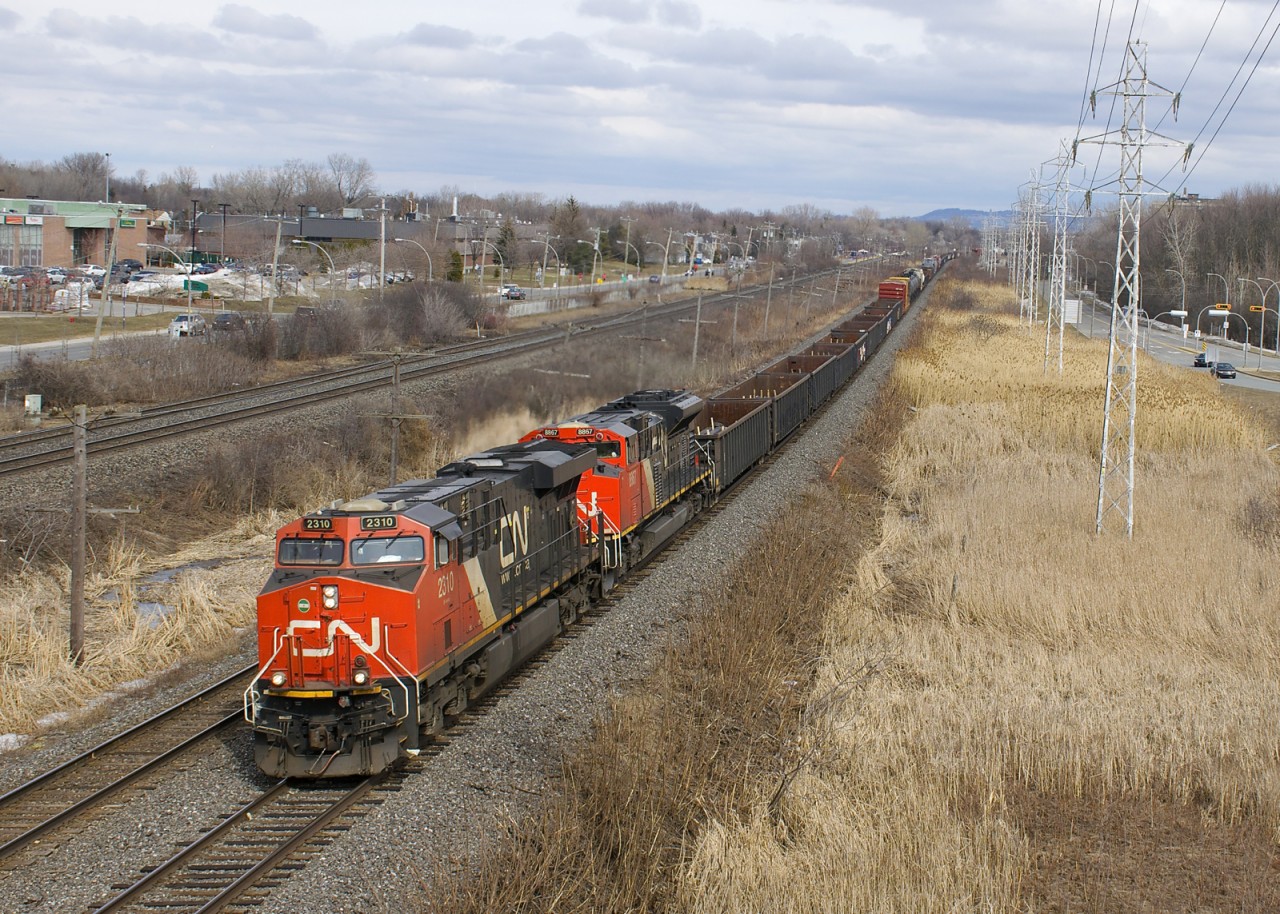 CN X321 with CN 2310 & CN 8867 and overflow traffic from Southwark Yard heads west through Pointe-Claire on the south track of CN's Kingston Sub.