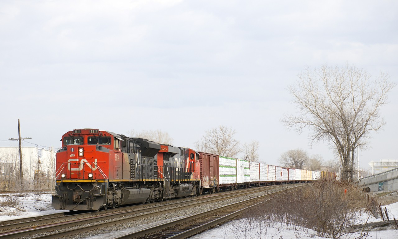 A 163-car CN 377 is through Dorval with CN 8814 and CN 2326 up front and CN 8920 mid-train.