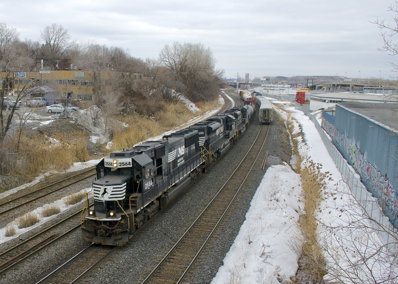 CN 529 with a paltry ten cars has ex-Conrail SD70 NS 2564, SD70ACe NS 1055 and SD70M-2 for power as it heads west on the Montreal Sub, with a late VIA 60 having just passed at right.