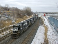 CN 529 with a paltry ten cars has ex-Conrail SD70 NS 2564, SD70ACe NS 1055 and SD70M-2 for power as it heads west on the Montreal Sub, with a late VIA 60 having just passed at right.