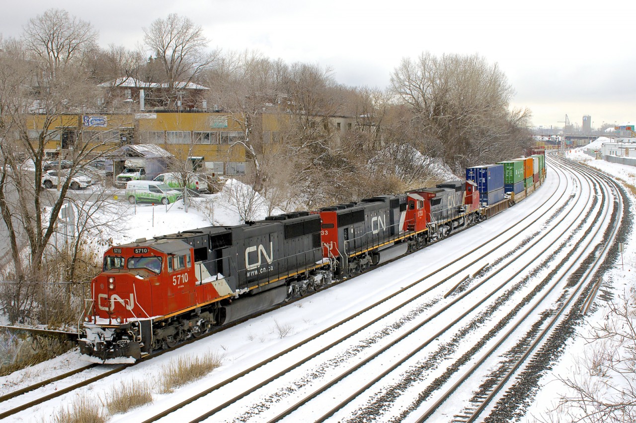CN 149 has SD75I's CN 5710 & CN 5733 & Dash8-40CW CN 2160 as it heads west on the transfer track of CN's Montreal Sub as it finishes up its lift of traffic left by CN 121 on track 29 the previous night.