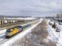 Wrapped unit VIA 6402 was stranded in Churchill for much of 2017 (along with an entire trainset) due to flooding of the rail line that leads to Churchill in the spring of 2017. This equipment was moved to Montreal by boat towards the end of 2017 and that equipment is now back in service. Here VIA 6402 leads VIA 65 past equipment working on demolishing the westbound lanes of autoroute 20, which were moved northwards recently. VIA 6402 does not have a Canada 150 or a VIA 40 logo at the moment, but two of of the coaches do have VIA 40 logos.
