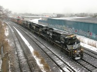 Two days worth of CN 529 have been combined as a 6-unit CN 529 heads through Montreal West in the driving snow. Lashup is NS 8039, NS 6934, NS 8101 (the Central of Georgia unit), BNSF 3895, UP 7361 & BNSF 7457, with 52 cars.