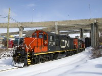 GP9's CN 7226 & CN 7075 have just passed under the Turcot interchange, which is being demolished and rebuilt, with some sections already gone. They are on the Turcot Holding Spur, which branches off of CN's Montreal Sub at MP 4 and serves a pair of clients at the end of the line, a short distance away. They will pick up some empties and then head to the East Side Canal Bank.