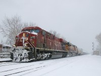 On the morning that Montrealers awoke to a decent amount of snow, CP 651 is passing Lasalle station with CP 8702 & BNSF 8150 for power as the snow continues to fall.