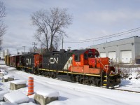 In a scene that see you less and less of, the Pointe St-Charles Switcher has GP9's CN 7075 & CN 7226 for power as it heads east on the Turcot Holding Spur with two empty boxcars picked up at the Kruger plant, one of two clients on this spur.