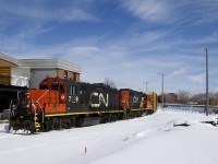  The Pointe St-Charles Switcher is stopped on the East Side Canal Bank Spur, waiting its turn to join the CN Montreal Sub. It will have to wait until intermodal train CN 120 passes. Power is GP9's CN 7226 & CN 7075.