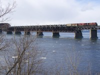 Empty ethanol train CP 651 has CP 8575 & CP 8754 for power, along with 2 buffer cars and 94 empty tank cars as it crosses the St. Lawrence River into Montreal.