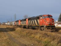 Remembrance Day 2011,...... 11/11/11. A day to remember the soldiers who fought for our freedoms and paid the ultimate price. Trackside, a CN crew is nearing the end of their tour with a trio of old soldiers in their own right. CN SD60F's 5552-5539-5529 haul Port Arthur bound grain through roughly the old station grounds in Westfort. Down in Port Arthur another set of SD60F's (5551-5522) were playing on an extra yard pulling and later spotting the elevators. The SD60F's still had a few years left, but they seemed to call on Thunder Bay in droves through the 2011 grain season.