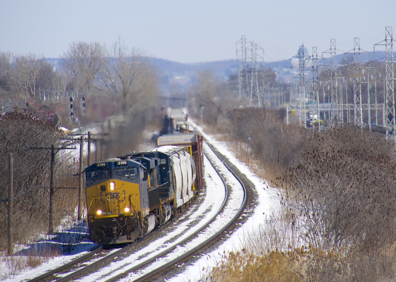 CSXT 3196 & CSXT 525 lead a 113-car CN 327 westwards on CN's Kingston Sub through Beaconsfield.