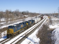 CSXT 3196 & CSXT 525 lead a 113-car CN 327 around a curve in Beaconsfield on a cold but sunny afternoon.