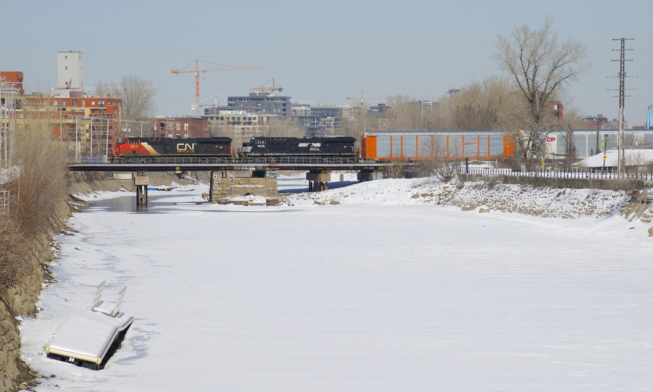 ES44AC's CN 2913 & NS 8039 lead CN 401 over the frozen Lachine Canal.