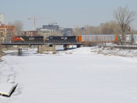 ES44AC's CN 2913 & NS 8039 lead CN 401 over the frozen Lachine Canal.