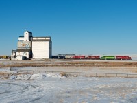 On a cold and quiet evening in Dodsland Saskatchewan a CP grain peddler rolls along at 10 MPH towards the elevator at Prairie West.  