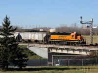 Rolling above the Pembina Highway, BNSF GP39-3 leads a lengthy drag of cars ex BNML trackage to the west and into CN's Fort Rouge yard. CN will haul the traffic south to interchange with BNSF at Emerson,MB/Noyes, Minnesota.