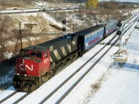 CN 3516 and a track evaluation train heading westbound, as seen from the Lemonville Road bridge vantage point. This locomotive later was sold to the St. Lawrence & Atlantic.