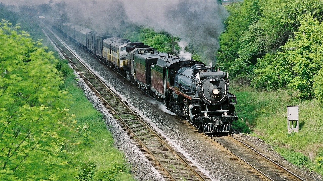 ...2816....


... how many ways: class/model, build year, manufacturers, original road build, original road number.... 2004 road number


 H 1 b / GP38-2 / FP9-A / F9B


 1930 – 1986 – 1958 – 1955


 MLW – GMD – GMD - GMD 


  CPR – CP Rail – CNR – CNR


 2816 – 3084 – 6541 - 6612


 2816 – 3084 – 1401 – 1900


...all this in year 2004....forty four years after CPR dropped all fires on the (operating) CPR steam fleet...


 …..what was the likelihood of an original CPR steam to operate on CPR track, by a CPR Crew, endorsed by CPR Management, on a CPR revenue run....


…..what is the likelihood anyone ever see – hear – photograph – witness - such a CPR operational sight ever again.....


…..by 2011  a guy named Bill Ackman ( Pershing Square Capital Management ) had acquired over 12% of the CPR publicly traded voting shares …


...and by 2012 Ackman had arranged for a guy named   Harrison Hunter  ( of ICR and CNR fame) to be the new Chief Executive.....


….and rest is history ...for better or worse... courtesy Ackman & HH


 At CPR Belleville Subdivision mile 169, Darlington Ontario, May     2004 Kodacolour negative by S.Danko


more CPR H class  ( Hudson type )


   H 1 b   at Tapscott 

 
    H 1 e   at Cherry Street