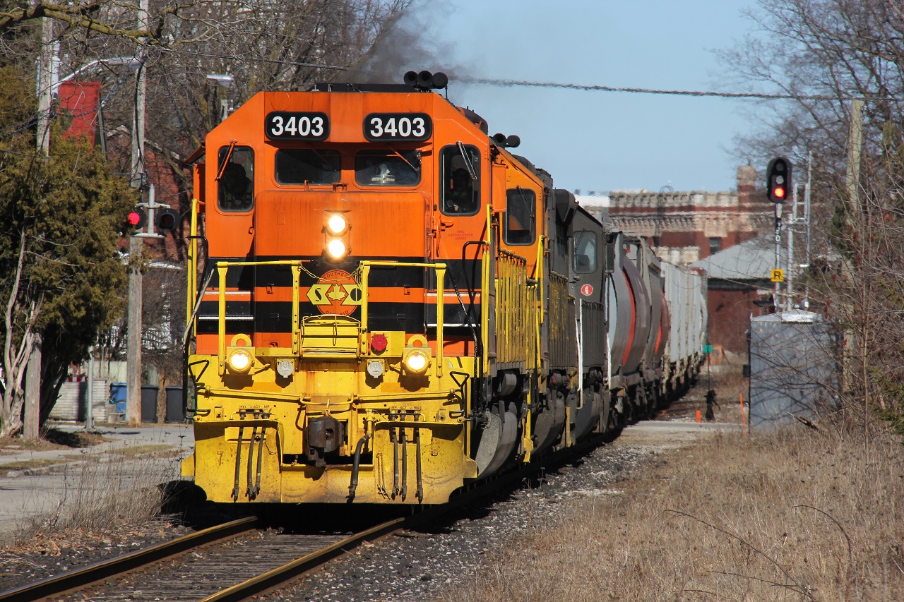 Happy St. Patrick's Day! GEXR 431 rolls west through Guelph along Kent St. approaching Glasgow St. Power is SOR 3403 (recently acquired), GEXR 3394 and GEXR 3054. I thought I would be getting this in Kitchener as well but 431 had no work there today so it managed to successfully get ahead of me and slingshot to Stratford. My chase would end at Alma St. just west of here. Nice sunshine!