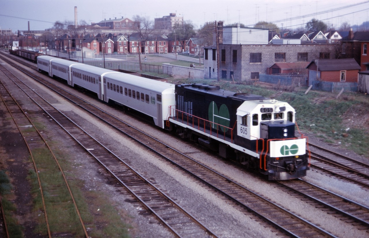 Now wearing GO Transit's first paint scheme, GP40TC 605 pushes a four car test train through Hamilton in May 1967. Those "GO kart" single level Hawker-Siddeley coaches had 94 seats, compared to 162 on the bi-levels now in use...hard to believe that a mid-day, off-peak train today has more capacity than an entire rush hour train when GO started its "three year experimental service" fifty-one years ago!