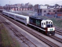 Now wearing GO Transit's first paint scheme, GP40TC 605 pushes a four car test train through Hamilton in May 1967. Those "GO kart" single level Hawker-Siddeley coaches had 94 seats, compared to 162 on the bi-levels now in use...hard to believe that a mid-day, off-peak train today has more capacity than an entire rush hour train when GO started its "three year experimental service" fifty-one years ago!