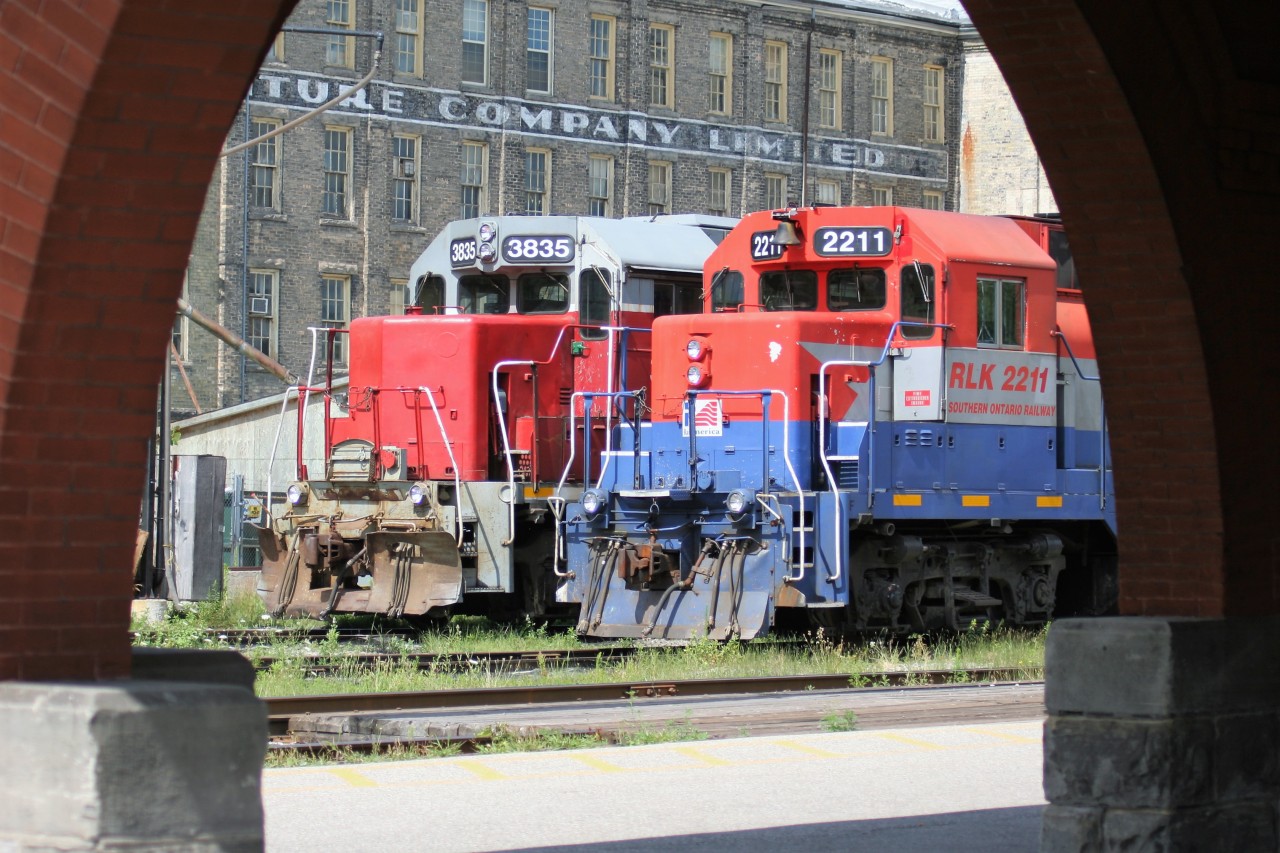 Both the RailTex and RailAmerica eras are represented on the Goderich-Exeter Railway (GEXR) as RLK GP35 2211 and GP38AC 3835 spend an afternoon waiting between assignments beside the VIA Rail station in Kitchener, Ontario.