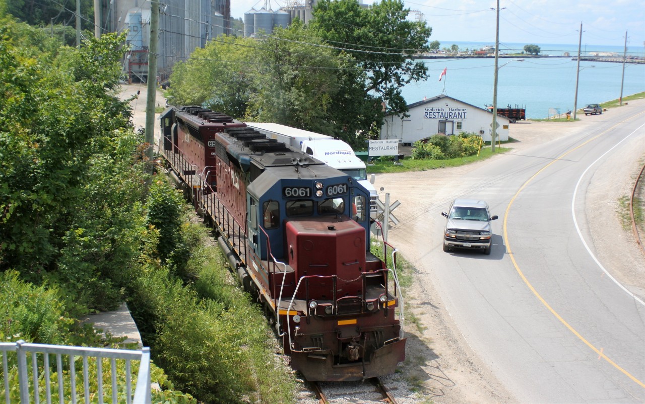 Goderich-Exeter Railway (GEXR) train 581 with HLCX SD40M-3’s 6061 and 6522 are seen at the Goderich, Ontario harbor as they make their way back towards the Goderich yard with mighty Lake Huron in the background.