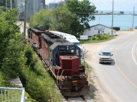 Goderich-Exeter Railway (GEXR) train 581 with HLCX SD40M-3’s 6061 and 6522 are seen at the Goderich, Ontario harbor as they make their way back towards the Goderich yard with mighty Lake Huron in the background. 
