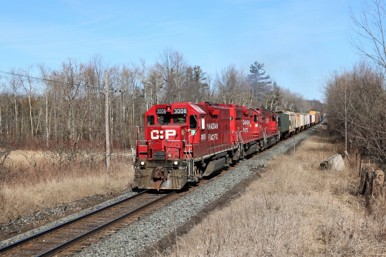 T69 is making the return trip westward with GP38AC, CP 3008 leading a pair of GP 38-2 in CP 3117 and CP 4407 after making a lift at Guelph Junction.