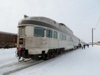 STAINLESS STEEL STOP AT SIOUX LOOKOUT. My wife Michelle and I recently travelled from Toronto to Vancouver in January on VIA Rail’s flagship train, the legendary 'Canadian'. The four day/ three night (in our case) journey included considerable time spent in the famous Dome Car and ours was the Glacier Park. One of 18 stainless steel Park cars built in 1954 for the Canadian Pacific Railway and named after a Canadian Park, this one represents Glacier National Park, located in the Selkirk Mountains of British Columbia. Obtained by VIA Rail in 1978 and with 14 others still in service, this 85 foot long 'Prestige'car has been beautifully refurbished with a downstairs lounge at the rear, a full bar-lounge in the center, and upstairs seating for 24 in the glass dome offering 360 degree viewing from the top of the train. We were blessed with an 11 hour delayed departure as it afforded us daylight views of parts of Canada seldom seen by any rail traveller such as the Canadian Shield, parts of the Prairie and most of British Columbia. In addition to the views of the passing countryside, the Canadian offers some of the finest meals anywhere from prime rib to shrimp and scallops, expertly prepared on board by the chefs in the diner. The trip was truly one of a lifetime. This image was taken at our second refuelling stop at Sioux Lookout, Ontario on January 29, 2018. The 25 minute stop allowed many of the passengers, including the photographer and his wife, to get off the train and take a look around. If on schedule, the westbound stop would have taken place at midnight.