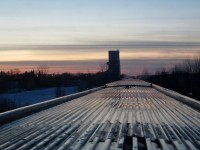 MANITOBA MOMENT. As the sun sets in Manitoba, VIA Rail Attendant Hayley announces that we are fast approaching the very first grain elevator to be seen from the Dome Car 'Glacier Park' on the 'Canadian' since departure from Toronto some 28 hours earlier. Just east of Winnipeg, the town of Dugald has one of the former Manitoba Pool elevators still intact and with a capacity of 4,010 tonnes, it is truly one of the rapidly disappearing Prairie landmarks. Dugald is also the infamous site of a 1947 train accident that claimed the lives of 31 people when CNR Extra 6001 ran into the eastbound 'Continental Limited' passenger train. For the photographer and his wife, it was a special moment that recaptured some some of the magic of their 1988 cross Canada rail trip when the first sign of an approaching Prairie town was the sight of a grain elevator in the distance.