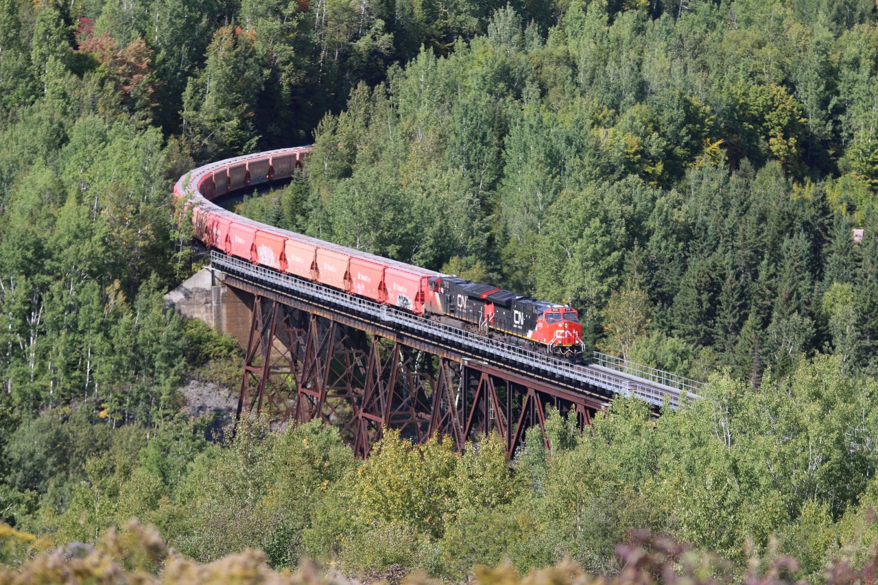 CN 3113 leads a 2 + 2 setup B730 potash unit train across the viaduct at St-Eleuthere, Qc along the Pelletier Sub heading for Saint John,NB.  Today the train has 124 Potash Corp cars and 1 Canpotex making the 125 car train 18715 tons and just over 6100 feet in length.
This train originates in Saskatchewan as 205 car lengths, at 30142 tons and 9931 feet.  This train is shortened at Joffre yard due to the Subdivions max tonnage.
You can view the video of the entire train here.  https://www.youtube.com/watch?v=BSlwmOTWoP4