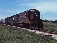 The Norfolk & Western-Southern Railway merger took place in June 1982; however, two years later, we see little sign of it as three black N&W units lead an eastbound train through Cayuga on their way from Windsor and St. Thomas to Buffalo. 