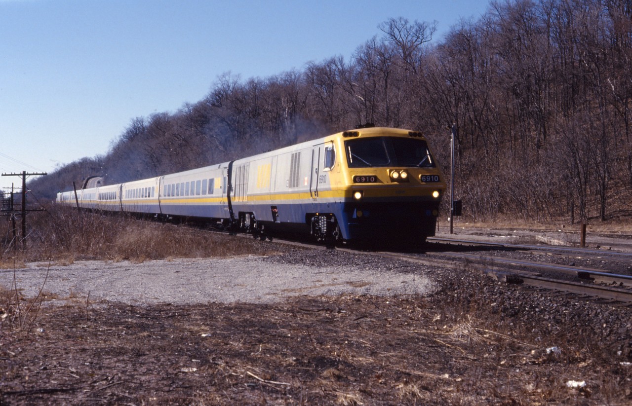 VIA LRC 6910 leads an six-car eastbound passenger train through Dundas in March 1988. Based on the sun angle, this looks like No. 72 (Windsor-Toronto). The trailing unit was the 6913.