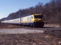 VIA LRC 6910 leads an six-car eastbound passenger train through Dundas in March 1988. Based on the sun angle, this looks like No. 72 (Windsor-Toronto). The trailing unit was the 6913.