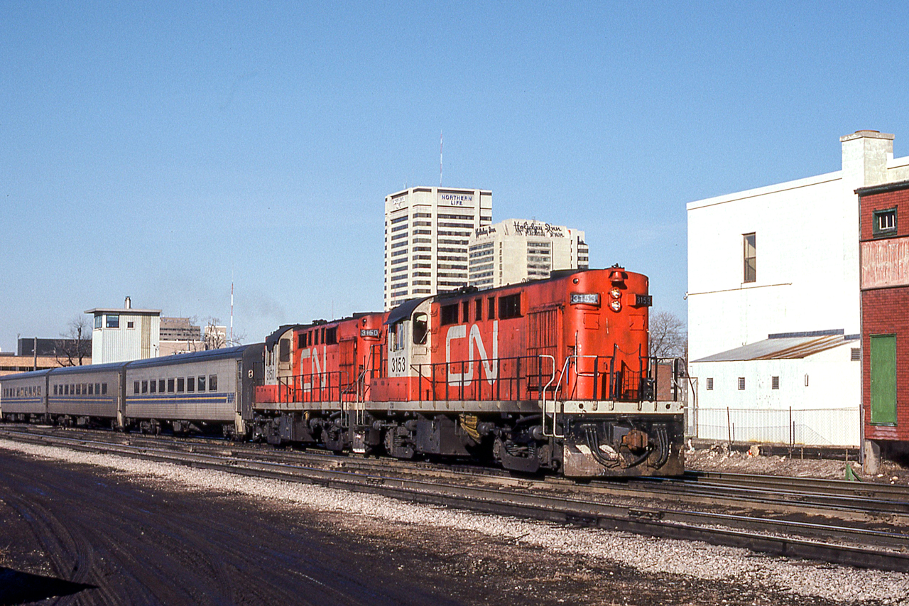 CN 3153 is eastbound in London, Ontario on the morning of March 25, 1981.