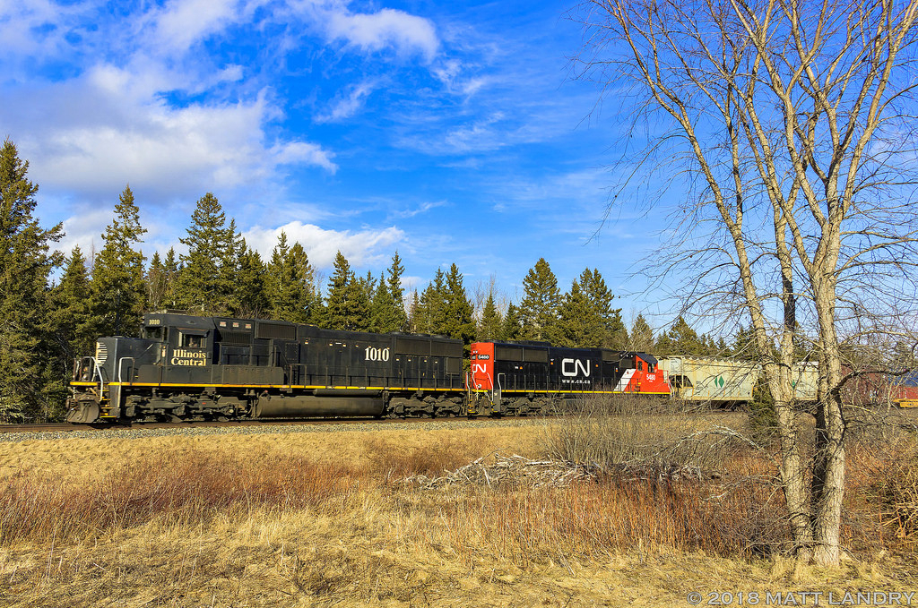 IC 1010, along with CN 5480, leads train A406, as they rumble by Passekeag, heading towards Saint John, New Brunswick. Not too often a nice lashup like this makes it to my area.