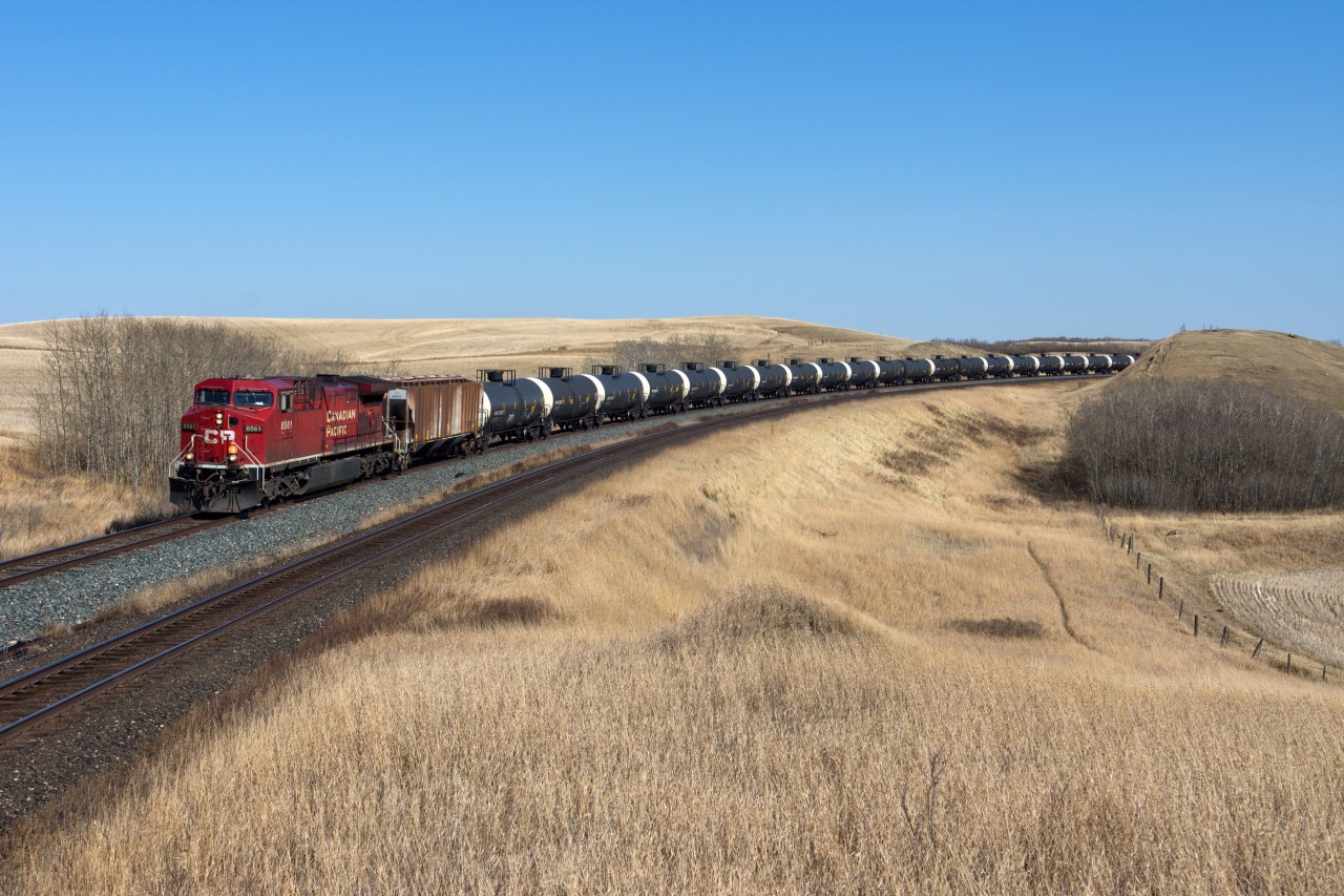 A westbound crude oil empty is seen just west of Keppel SK on the Wilkie Sub. The track in the foreground is CN's busy Watrous Sub.